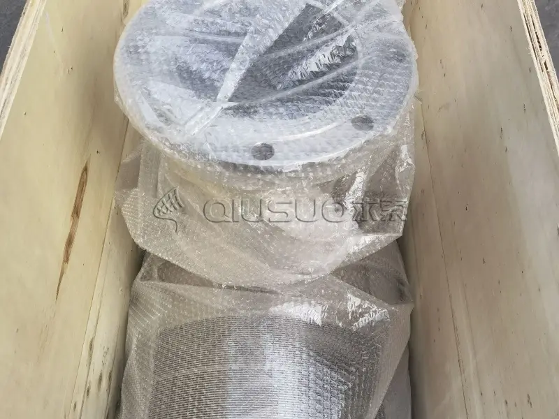 A wedge wire intake screen is packed with plastic bubble film and wooden cases.