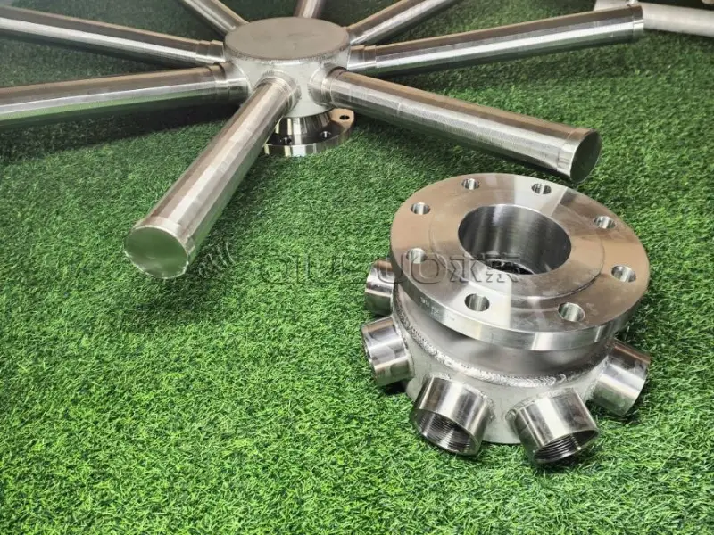 A hub and 8 laterals hub radial lateral assemblies are placed on the lawn.