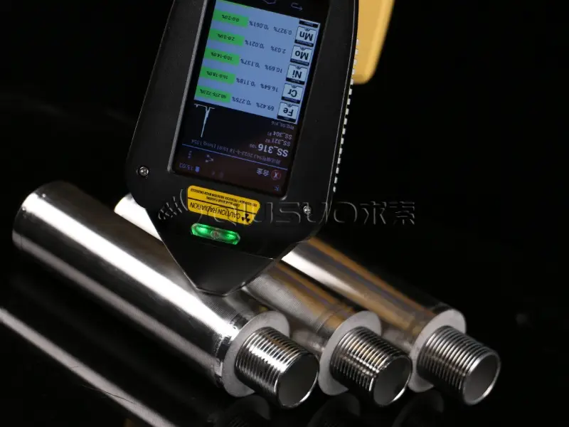 A worker is analyzing the material content of wedge wire tube and the screen shows SS 316.