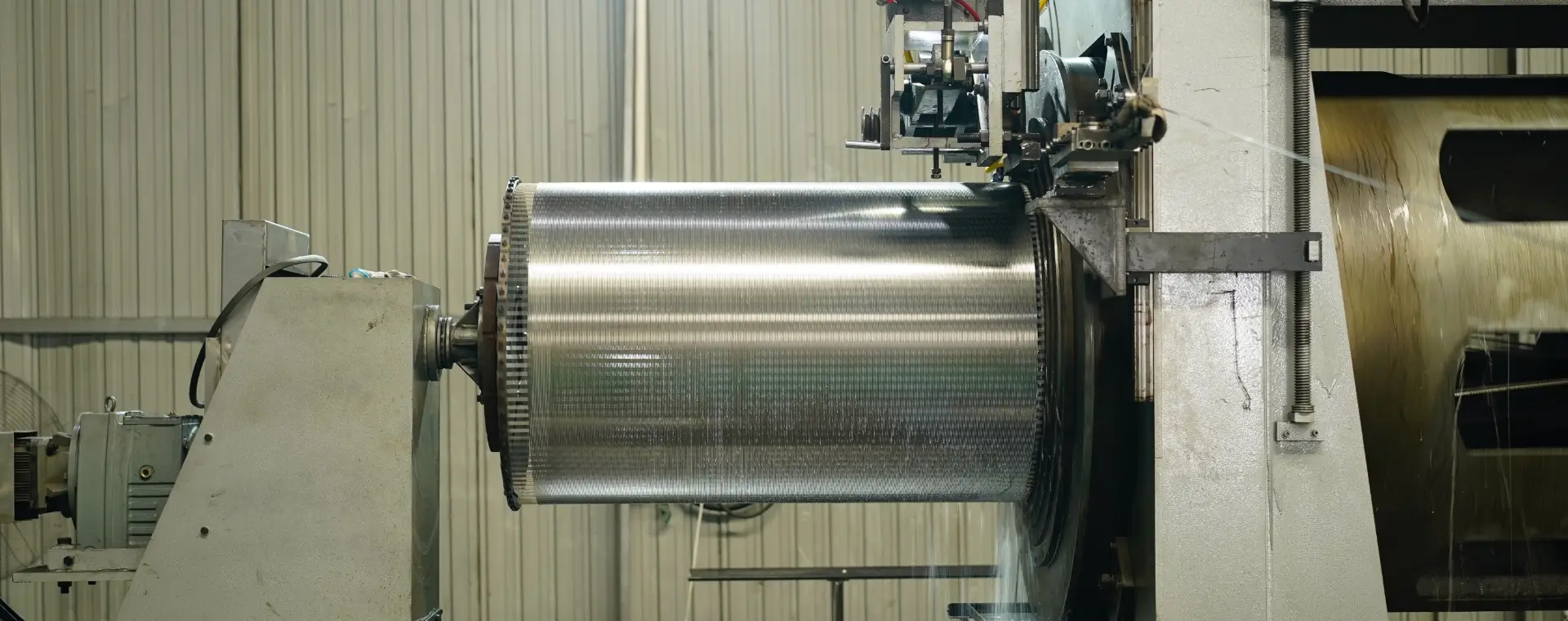 An equipment is producing wedge wire screen cylinders.