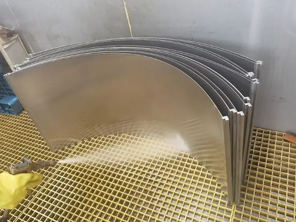 Several wedge wire sieve bends in the workshop