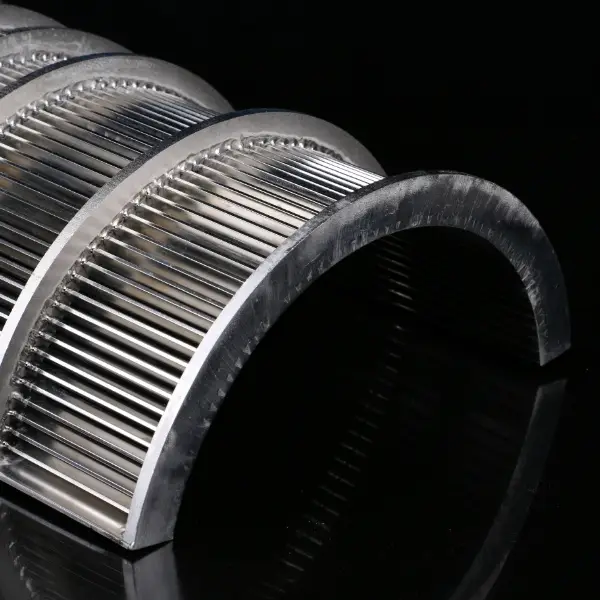 A piece of wedge wire sieve bend on black background.